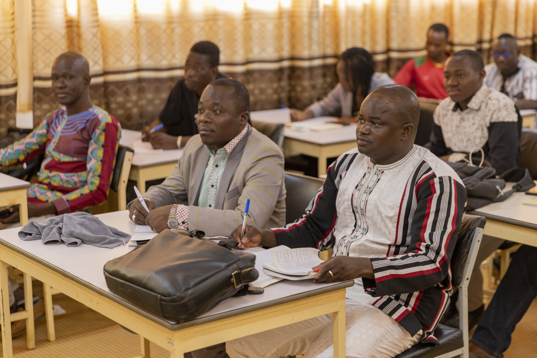 7 March 2020 - Ouagadougou, Burkina Faso. Students of the anti-corruption master at the Ouaga II University. 

Supported by UNODC, Burkina Faso has launched its first master's programme on anti-corruption in March 2019. The master's project was developed with technical support from UNODC and Tunisian academics, who shared their own experience with the Burkina academics in a South-South cooperation perspective.

Education is a fundamental tool to prevent crime and corruption. In addition to promoting a culture that supports the rule of law, crime prevention and criminal justice, introducing anti-corruption curricula in higher education also helps to build the capacities of future professionals responsible for the fight against corruption

In supporting the fight against corruption through this master's programme, UNODC, through the Regional Programme for West Africa (2016-2020), intends to contribute to the achievement of Sustainable Development Goal (SDG) 16, which calls to "Promote peaceful and inclusive societies for sustainable development, provide access to justice for all and build effective, accountable and inclusive institutions at all levels",  This result was achieved under the framework of the Sahel Programme covering Burkina Faso.

UNODC / Aurélia Rusek